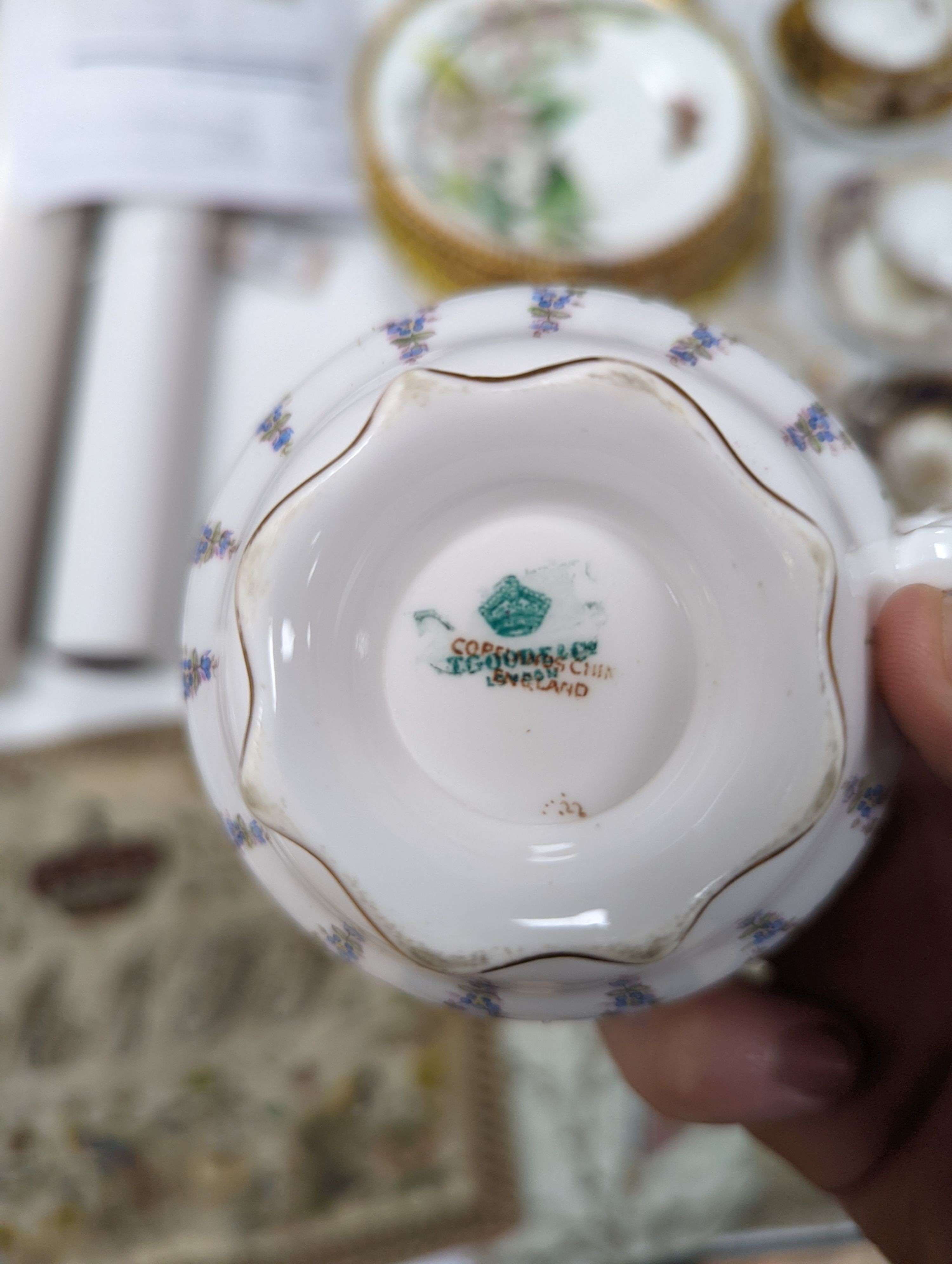 A small collection of Victorian porcelain tea cups and saucers and sundry dessert plates